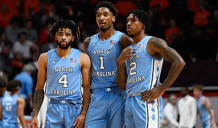 Dec 4, 2022; Blacksburg, Virginia, USA; North Carolina Tar Heels guard R.J. Davis (4) forward Leaky Black (1) and guard Caleb Love (2) at mid court during a Virginia Tech Hokies foul shot at Cassell Coliseum. Mandatory Credit: Lee Luther Jr.-USA TODAY Sports