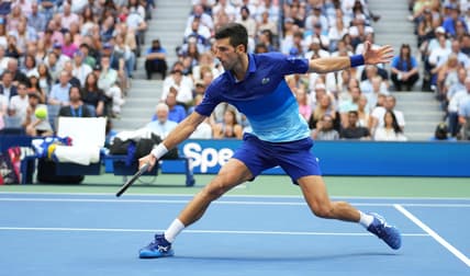Sep 12, 2021; Flushing, NY, USA; Novak Djokovic of Serbia hits a shot against Daniil Medvedev of Russia in the men's singles final on day fourteen of the 2021 U.S. Open tennis tournament at USTA Billie Jean King National Tennis Center. Mandatory Credit: Danielle Parhizkaran-USA TODAY Sports