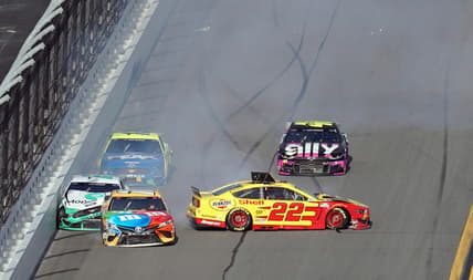 Feb 9, 2020; Daytona Beach, Florida, USA; NASCAR Cup Series driver Brad Keselowski (2) driver Kyle Busch (18) and driver Joey Logano (22) wreck into the trioval during The Clash at Dayonta at Daytona International Speedway. Mandatory Credit: John David Mercer-USA TODAY Sports