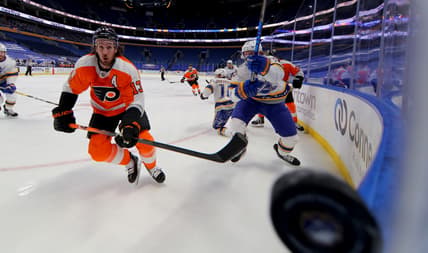 Feb 28, 2021; Buffalo, New York, USA; Philadelphia Flyers center Kevin Hayes (13) watches the puck as it goes along the glass during the first period against the Buffalo Sabres at KeyBank Center. Mandatory Credit: Timothy T. Ludwig-USA TODAY Sports
