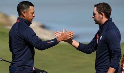 Sep 25, 2021; Haven, Wisconsin, USA; Team USA player Xander Schauffele shakes hands with Team USA player Patrick Cantlay after their win on the 17th green during day two foursomes rounds for the 43rd Ryder Cup golf competition at Whistling Straits. Mandatory Credit: Orlando Ramirez-USA TODAY Sports