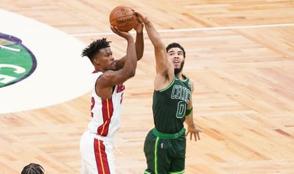 May 11, 2021; Boston, Massachusetts, USA; Boston Celtics forward Jayson Tatum (0) blocks the shot of Miami Heat forward Jimmy Butler (22) in the first quarter at TD Garden. Mandatory Credit: David Butler II-USA TODAY Sports