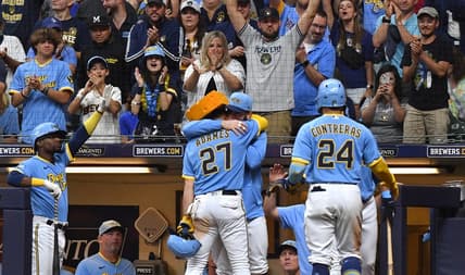 Jul 7, 2023; Milwaukee, Wisconsin, USA; Milwaukee Brewers designated hitter Jesse Winker (33) congratulates Milwaukee Brewers shortstop Willy Adames (27) after hitting a home run against the Cincinnati Reds in the fifth inning at American Family Field. Mandatory Credit: Michael McLoone-USA TODAY Sports