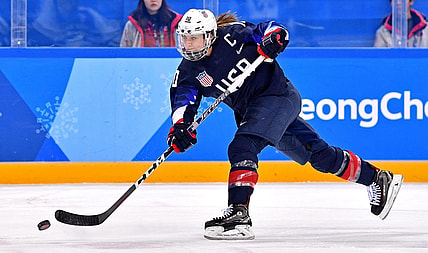 Feb 18, 2018; Gangneung, South Korea; United States forward Meghan Duggan (10) shoots the puck against Finland in the women's ice hockey semifinals during the Pyeongchang 2018 Olympic Winter Games at Gangneung Hockey Centre. Mandatory Credit: Andrew Nelles-USA TODAY Sports