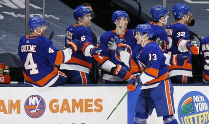 Apr 1, 2021; Uniondale, New York, USA; New York Islanders center Mathew Barzal (13) is congratulated after scoring his third goal of the game for a hat trick against the Washington Capitals during the third period at Nassau Veterans Memorial Coliseum. Mandatory Credit: Andy Marlin-USA TODAY Sports