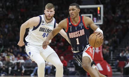 Dec 23, 2022; Houston, Texas, USA; Houston Rockets forward Jabari Smith Jr. (1) dribbles the ball as Dallas Mavericks forward Davis Bertans (44) defends during the first half at Toyota Center. Mandatory Credit: Troy Taormina-USA TODAY Sports