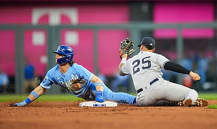 Sep 30, 2023; Kansas City, Missouri, USA; Kansas City Royals shortstop Bobby Witt Jr. (7) is caught stealing against New York Yankees second baseman Gleyber Torres (25) during the third inning at Kauffman Stadium. Mandatory Credit: Jay Biggerstaff-USA TODAY Sports
