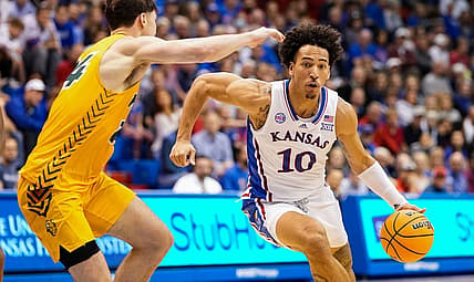 Nov 10, 2022; Lawrence, Kansas, USA; Kansas Jayhawks forward Jalen Wilson (10) drives against North Dakota State Bison guard Boden Skunberg (14) during the second half at Allen Fieldhouse. Mandatory Credit: Jay Biggerstaff-USA TODAY Sports