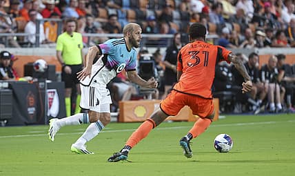 Jul 12, 2023; Houston, Texas, USA; Minnesota United FC forward Teemu Pukki (22) attempts to control the ball as Houston Dynamo FC defender Micael (31) defends during the first half at Shell Energy Stadium. Mandatory Credit: Troy Taormina-USA TODAY Sports