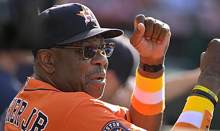 Jul 16, 2023; Anaheim, California, USA;  Houston Astros manager Dusty Baker Jr. (12) gives signs from the dugout in the fifth inning against the Los Angeles Angels at Angel Stadium. Mandatory Credit: Jayne Kamin-Oncea-USA TODAY Sports
