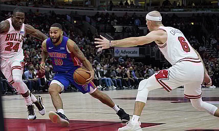 Oct 23, 2021; Chicago, Illinois, USA; Detroit Pistons guard Cory Joseph (18) is defended by Chicago Bulls guard Javonte Green (24) and guard Alex Caruso (6) during the second half at United Center. Mandatory Credit: David Banks-USA TODAY Sports