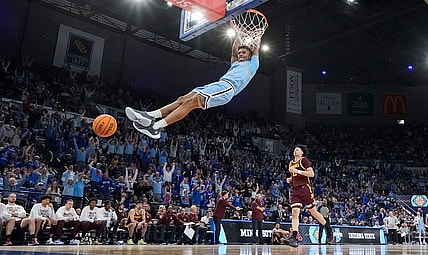 Indiana State Sycamores guard Julian Larry (1) dunks the ball Sunday, March 24, 2024, during the second round of the NIT at the Hulman Center in Terre Haute. The Indiana State Sycamores defeated the Minnesota Golden Gophers, 76-64.