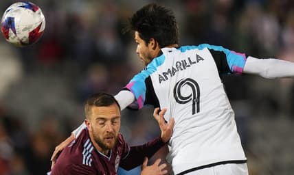 Mar 18, 2023; Commerce City, Colorado, USA; Colorado Rapids defender Danny Wilson (4) fights for the ball against Minnesota United forward Luis Amarilla (9) at Dick's Sporting Goods Park. Mandatory Credit: Ron Chenoy-USA TODAY Sports