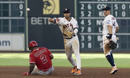 Jun 3, 2023; Houston, Texas, USA;  Los Angeles Angels third baseman Luis Rengifo (2) is forced out at second base by Houston Astros shortstop Jeremy Pena (3) while second baseman Mauricio Dubon (14) looks on in the fifth inning at Minute Maid Park. Mandatory Credit: Thomas Shea-USA TODAY Sports