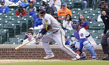 Apr 24, 2021; Chicago, Illinois, USA; Milwaukee Brewers first baseman Keston Hiura (18) hits a double against the Chicago Cubs during the fifth inning at Wrigley Field. Mandatory Credit: David Banks-USA TODAY Sports