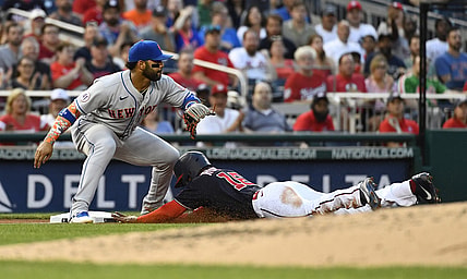 Jun 18, 2021; Washington, District of Columbia, USA; /Washington Nationals center fielder Victor Robles (16) beats the tag by New York Mets third baseman Jonathan Villar (1) during the third inning at Nationals Park. Mandatory Credit: Brad Mills-USA TODAY Sports