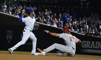 Jul 7, 2021; Chicago, Illinois, USA; Chicago Cubs shortstop Sergio Alcantara (51) forces out Philadelphia Phillies third baseman Alec Bohm (28) at second base during the fifth inning at Wrigley Field. Mandatory Credit: David Banks-USA TODAY Sports
