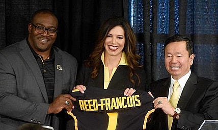 University of Missouri Curator Daryl Chatman, left, and System President Mun Choi present new athletic director Desiree Reed-Francois with a jersey Wednesday after she was formally introduced at the Walsworth Family Columns Club.

20210811 033a Mu Athletic Director Reed Francois Press Conf