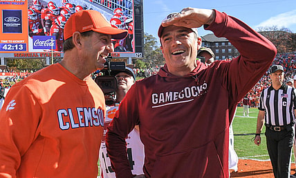 Nov 26, 2022; Clemson, SC, USA; Clemson head coach Dabo Swinney, left, and South Carolina head coach Shane Beamer talk before the game at Memorial Stadium in Clemson, S.C. Saturday, Nov. 26, 2022.    Mandatory Credit: Ken Ruinard-USA TODAY Sports