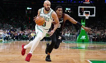 Mar 18, 2024; Boston, Massachusetts, USA; Boston Celtics guard Derrick White (9) drives the ball against Detroit Pistons guard Jaden Ivey (23) in the first quarter at TD Garden. Mandatory Credit: David Butler II-USA TODAY Sports