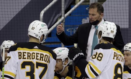Mar 16, 2021; Pittsburgh, Pennsylvania, USA; Boston Bruins had coach Bruce Cassidy (rear) talks to center Patrice Bergeron (37) and right wing David Pastrnak (88) during a time-out in the third period against the Pittsburgh Penguins at PPG Paints Arena.  Boston won 2-1. Mandatory Credit: Charles LeClaire-USA TODAY Sports