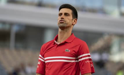 Jun 11, 2021; Paris, France; Novak Djokovic (SRB) reacts during his semifinal match against Rafael Nadal (ESP) on day 13 of the French Open at Stade Roland Garros. Mandatory Credit: Susan Mullane-USA TODAY Sports