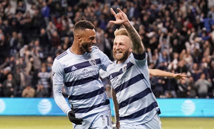 Mar 26, 2022; Kansas City, Kansas, USA; Sporting Kansas City forward Johnny Russell (7) celebrates with forward Khiry Shelton (11) after scoring against Real Salt Lake during the second half at Children's Mercy Park. Mandatory Credit: Denny Medley-USA TODAY Sports