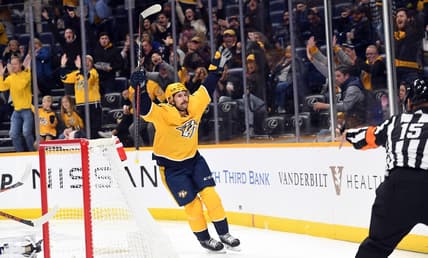 Nov 17, 2022; Nashville, Tennessee, USA; Nashville Predators left wing Filip Forsberg (9) celebrates after a goal during the first period against the New York Islanders at Bridgestone Arena. Mandatory Credit: Christopher Hanewinckel-USA TODAY Sports