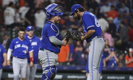 Apr 18, 2023; Houston, Texas, USA; Toronto Blue Jays catcher Alejandro Kirk (30) and relief pitcher Jordan Romano (68) celebrate after the Blue Jays defeated the Houston Astros at Minute Maid Park. Mandatory Credit: Troy Taormina-USA TODAY Sports