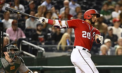 Aug 31, 2022; Washington, District of Columbia, USA; Washington Nationals catcher Keibert Ruiz (20) hits a single against the Oakland Athletics during the fourth inning at Nationals Park. Mandatory Credit: Brad Mills-USA TODAY Sports