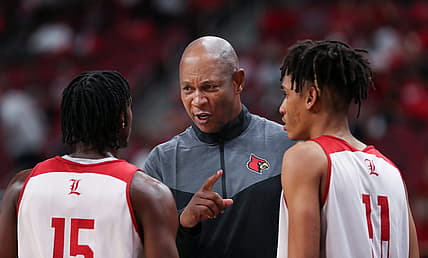 U of L head basketball coach Kenny Payne, center, instructed Hercy Miller (15)  and Fabio Basili (11) during their red/white scrimmage at the Yum Center in Louisville, Ky. on Oct. 23, 2022.

Uofl Scrimmage15 Sam