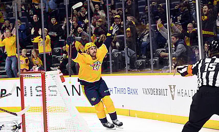 Nov 17, 2022; Nashville, Tennessee, USA; Nashville Predators left wing Filip Forsberg (9) celebrates after a goal during the first period against the New York Islanders at Bridgestone Arena. Mandatory Credit: Christopher Hanewinckel-USA TODAY Sports