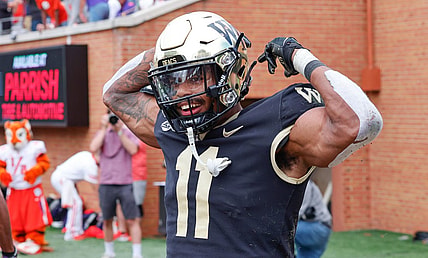 Sep 24, 2022; Winston-Salem, North Carolina, USA;  Wake Forest Demon Deacons wide receiver Donavon Greene (11) celebrates a touchdown during the second half against the Clemson Tigers at Truist Field. Mandatory Credit: Reinhold Matay-USA TODAY Sports