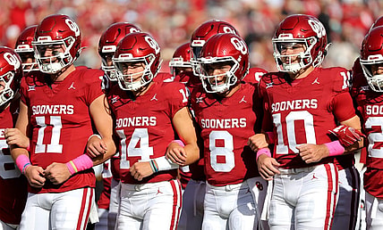 OU's Davis Beville (11), General Booty (14), Oklahoma's Dillon Gabriel (8) and Jackson Arnold (10) link arms before the college football game between the University of Oklahoma Sooners and the University of Central Florida Knights at the Gaylord Family Oklahoma Memorial Stadium in Norman, Okla., Saturday, Oct., 21, 2023.