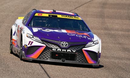 Oct 23, 2022; Homestead, Florida, USA; NASCAR Cup Series driver Denny Hamlin (11) races into turn one during the Dixie Vodka 400 at Homestead-Miami Speedway. Mandatory Credit: John David Mercer-USA TODAY Sports