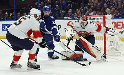 Dec 27, 2023; Tampa, Florida, USA; Florida Panthers defenseman Aaron Ekblad (5), Tampa Bay Lightning left wing Nicholas Paul (20) and Florida Panthers goaltender Sergei Bobrovsky (72) go after the puck during the first period at Amalie Arena. Mandatory Credit: Kim Klement Neitzel-USA TODAY Sports