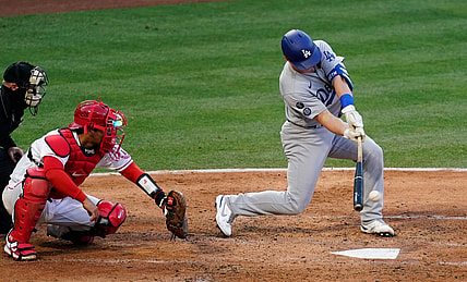 May 8, 2021; Anaheim, California, USA; Los Angeles Dodgers designated hitter Will Smith (16) hits a two run RBI single in the fourth inning against the Los Angeles Angels at Angel Stadium. Mandatory Credit: Robert Hanashiro-USA TODAY Sports