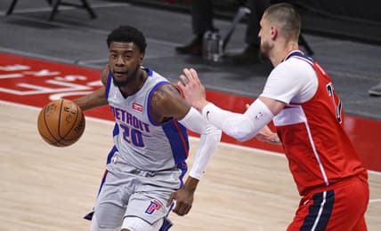 Apr 1, 2021; Detroit, Michigan, USA; Detroit Pistons guard Josh Jackson (20) drives to the basket as Washington Wizards center Alex Len (27) defends during the first quarter at Little Caesars Arena. Mandatory Credit: Tim Fuller-USA TODAY Sports