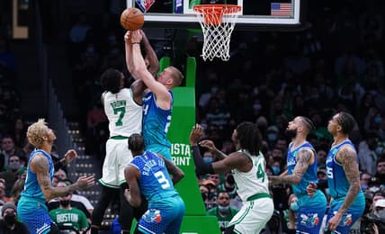 Feb 2, 2022; Boston, Massachusetts, USA; Charlotte Hornets center Mason Plumlee (24) defends against Boston Celtics guard Jaylen Brown (7) in the second quarter at TD Garden. Mandatory Credit: David Butler II-USA TODAY Sports