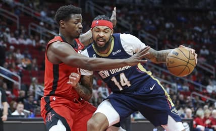 Mar 19, 2023; Houston, Texas, USA; New Orleans Pelicans forward Brandon Ingram (14) controls the ball as Houston Rockets forward Jae'Sean Tate (8) defends during the second quarter at Toyota Center. Mandatory Credit: Troy Taormina-USA TODAY Sports