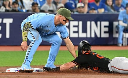 May 19, 2023; Toronto, Ontario, CAN;  Toronto Blue Jays third baseman Matt Chapman (26) tags out Baltimore Orioles right fielder Ryan McKenna (26) as he tried to advance from second on an errant pickoff throw in the second inning at Rogers Centre. Mandatory Credit: Dan Hamilton-USA TODAY Sports