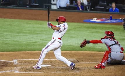 Jun 6, 2023; Arlington, Texas, USA; Texas Rangers second baseman Marcus Semien (2) hits a two-run double during the fourth inning against the St. Louis Cardinals at Globe Life Field. Mandatory Credit: Kevin Jairaj-USA TODAY Sports