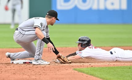 Aug 6, 2023; Cleveland, Ohio, USA;  Cleveland Guardians center fielder Myles Straw (7) is caught stealing by Chicago White Sox second baseman Zach Remillard (28) during the third inning at Progressive Field. Mandatory Credit: Ken Blaze-USA TODAY Sports