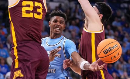 Indiana State Sycamores guard Julian Larry (1) passes the ball against Minnesota Golden Gophers forward Dawson Garcia (3) and Minnesota Golden Gophers forward Parker Fox (23) on Sunday, March 24, 2024, during the second round of the NIT at the Hulman Center in Terre Haute.