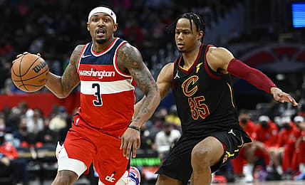 Dec 30, 2021; Washington, District of Columbia, USA; Washington Wizards guard Bradley Beal (3) dribbles past Cleveland Cavaliers forward Isaac Okoro (35) during the second half at Capital One Arena. Mandatory Credit: Brad Mills-USA TODAY Sports