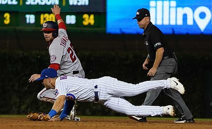 Aug 8, 2022; Chicago, Illinois, USA; Washington Nationals right fielder Lane Thomas (28) is safe at second base against Chicago Cubs shortstop Nico Hoerner (2) during the fifth inning at Wrigley Field. Mandatory Credit: David Banks-USA TODAY Sports
