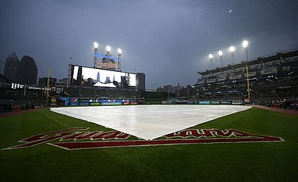 Jul 1, 2022; Cleveland, Ohio, USA; The tarp covers the field as the game between the Cleveland Guardians and the New York Yankees is delayed at Progressive Field. Mandatory Credit: Ken Blaze-USA TODAY Sports