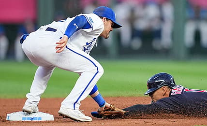 Sep 6, 2022; Kansas City, Missouri, USA; Cleveland Guardians second baseman Andres Gimenez (0) is caught stealing second base by Kansas City Royals second baseman Michael Massey (19) during the first inning at Kauffman Stadium. Mandatory Credit: Jay Biggerstaff-USA TODAY Sports