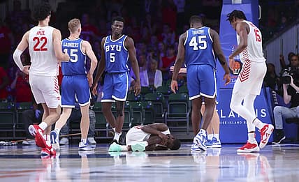 Nov 25, 2022; Paradise Island, BAHAMAS; Dayton Flyers guard Kobe Elvis (24) lays injured on the floor during the second half against the Brigham Young Cougars at Imperial Arena. Mandatory Credit: Kevin Jairaj-USA TODAY Sports