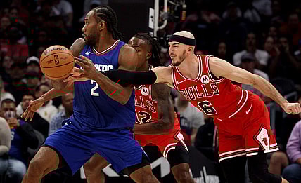 Mar 9, 2024; Los Angeles, California, USA; Chicago Bulls guard Alex Caruso (6) knocks the ball away from LA Clippers forward Kawhi Leonard (2) during the second quarter at Crypto.com Arena. Mandatory Credit: Jason Parkhurst-USA TODAY Sports